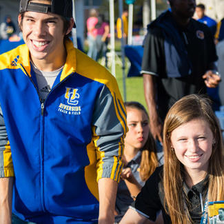 male and female wearing UCR gear smiling
