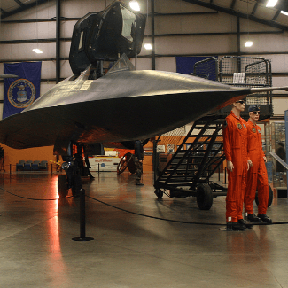two mannequins standing by an air craft